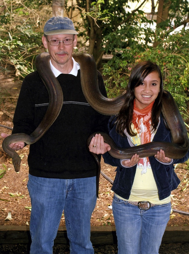 Bob and Connie Holding Olive Python